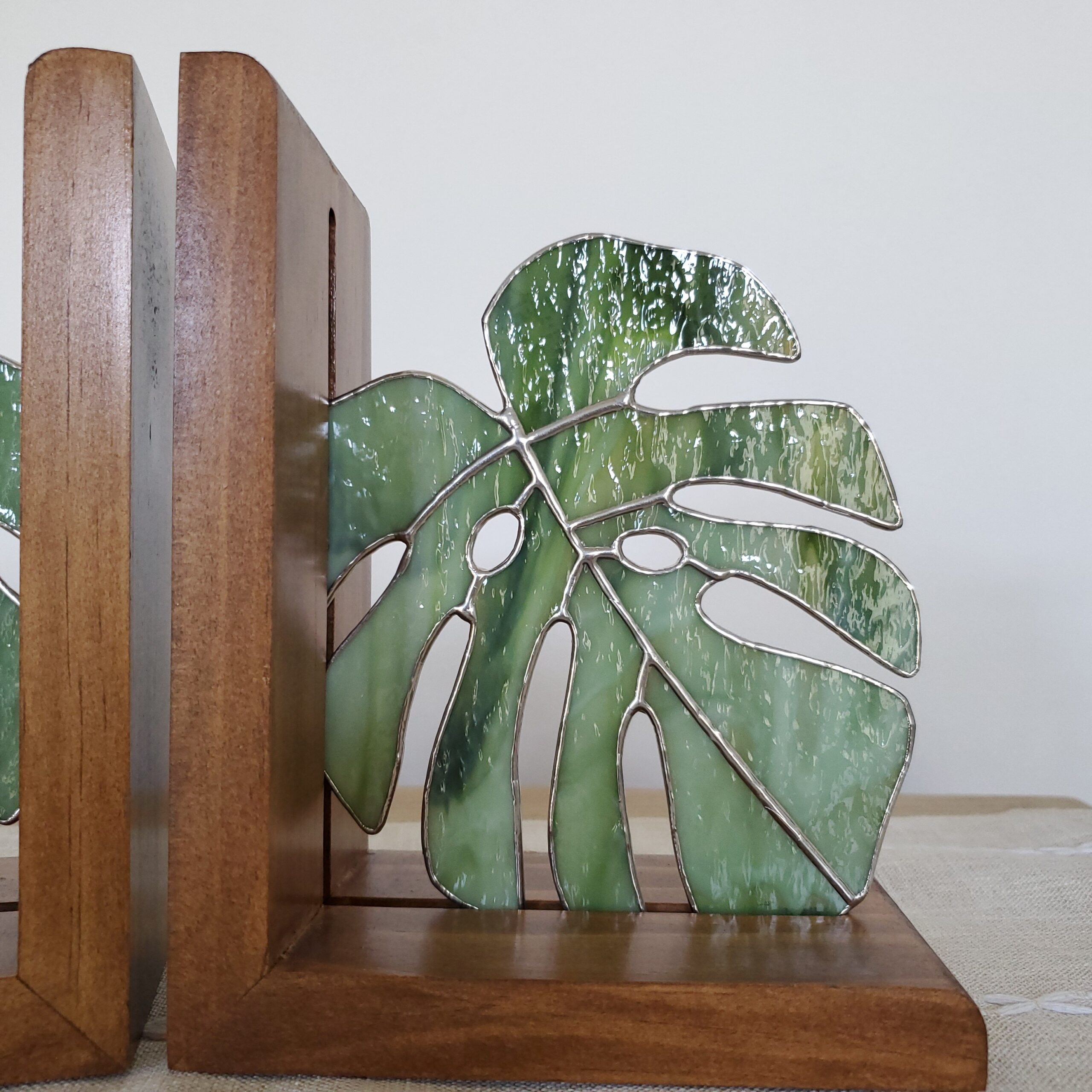 Monstera Stained Glass Bookends in a Home Setting